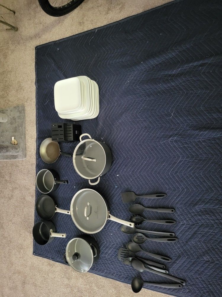 Pots Pans And Set Of Blowls And Plates