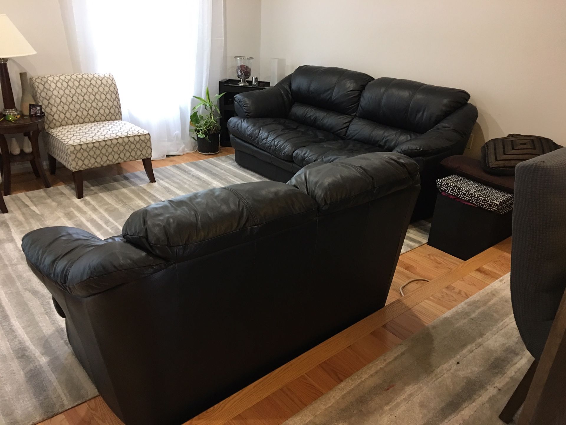 2 Black leather sofas