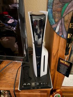 PS5 with three games.