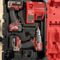 Milwaukee M18 FUEL 2-Tool Combo Kit (model 3697-22), which includes a high-end Hammer Drill, Impact Driver, two XC5.0 batteries, and a charger.