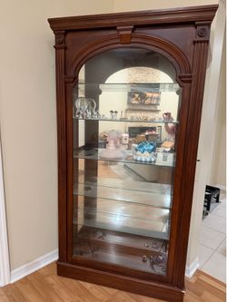 Cherry wood curio cabinet with light
