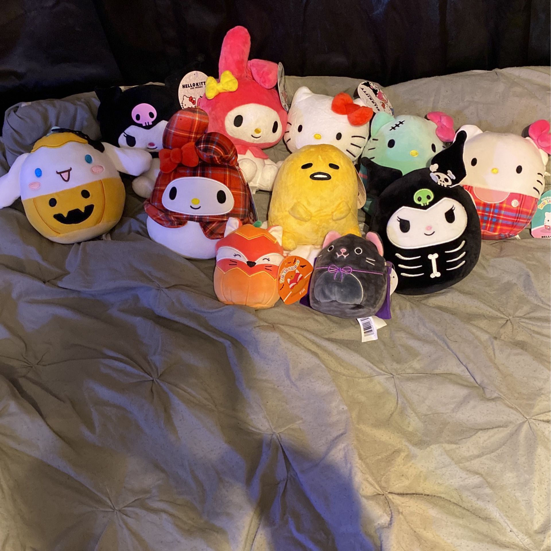 A Bunch Of Hello Kitty Plushies 