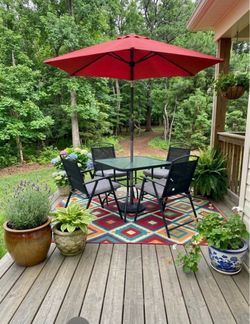 43” Square Patio Set with Foldable Chairs and a Red Umbrella