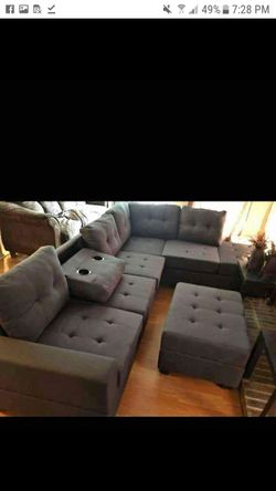 New dark grey reversible sectional and ottoman
