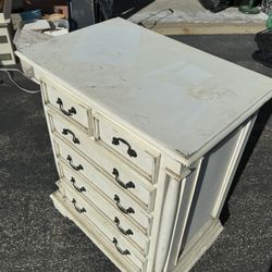 Tall, ivory coloured chest of 6 drawers. Lovely handles and detail throughout.