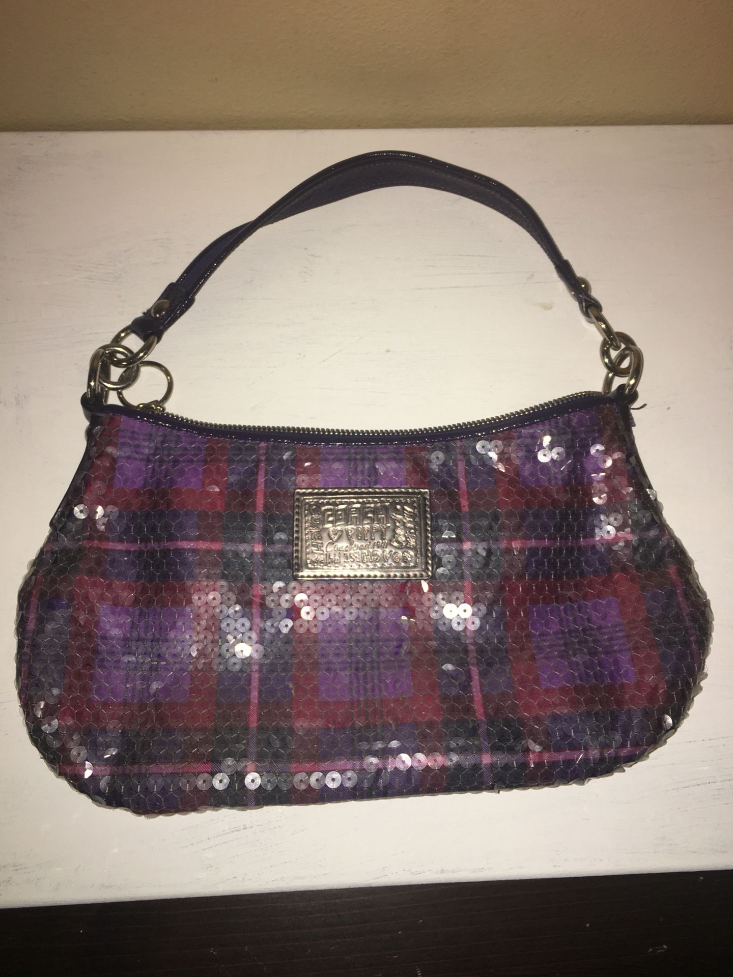 Coach and Tommy Hilfiger purses