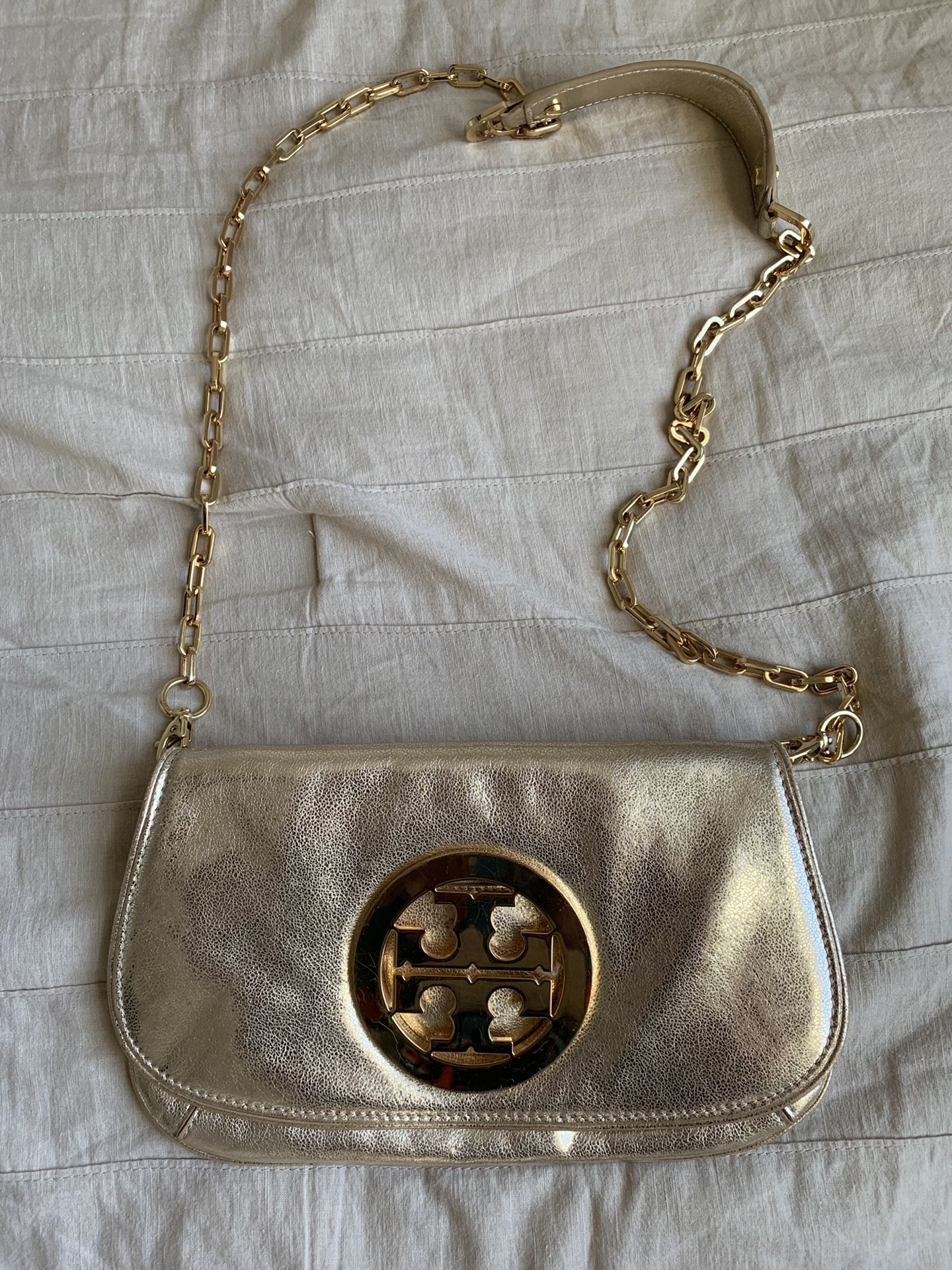 Limited edition Tory Burch Gold Reva Clutch PREOWNED/USED Tory Burch for  Sale in Katy, TX - OfferUp