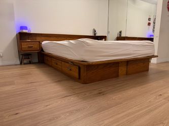 Vintage 1970’s oak queen platform bed with floating nightstands and storage underneath