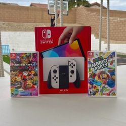 Nintendo Switch Oled with super Mario party and Mario kart deluxe 8 floor model