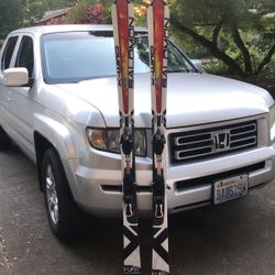 Skis, Bindings, Ski Boots, And Poles