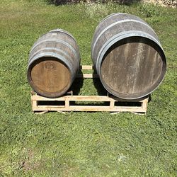 Artisan French oak wood barrels and metal rack