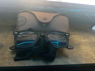 These are Ray-Ban Original Wayfarer Classic sunglasses, specifically the RB2140 model with a brown-on-transparent-blue frame.