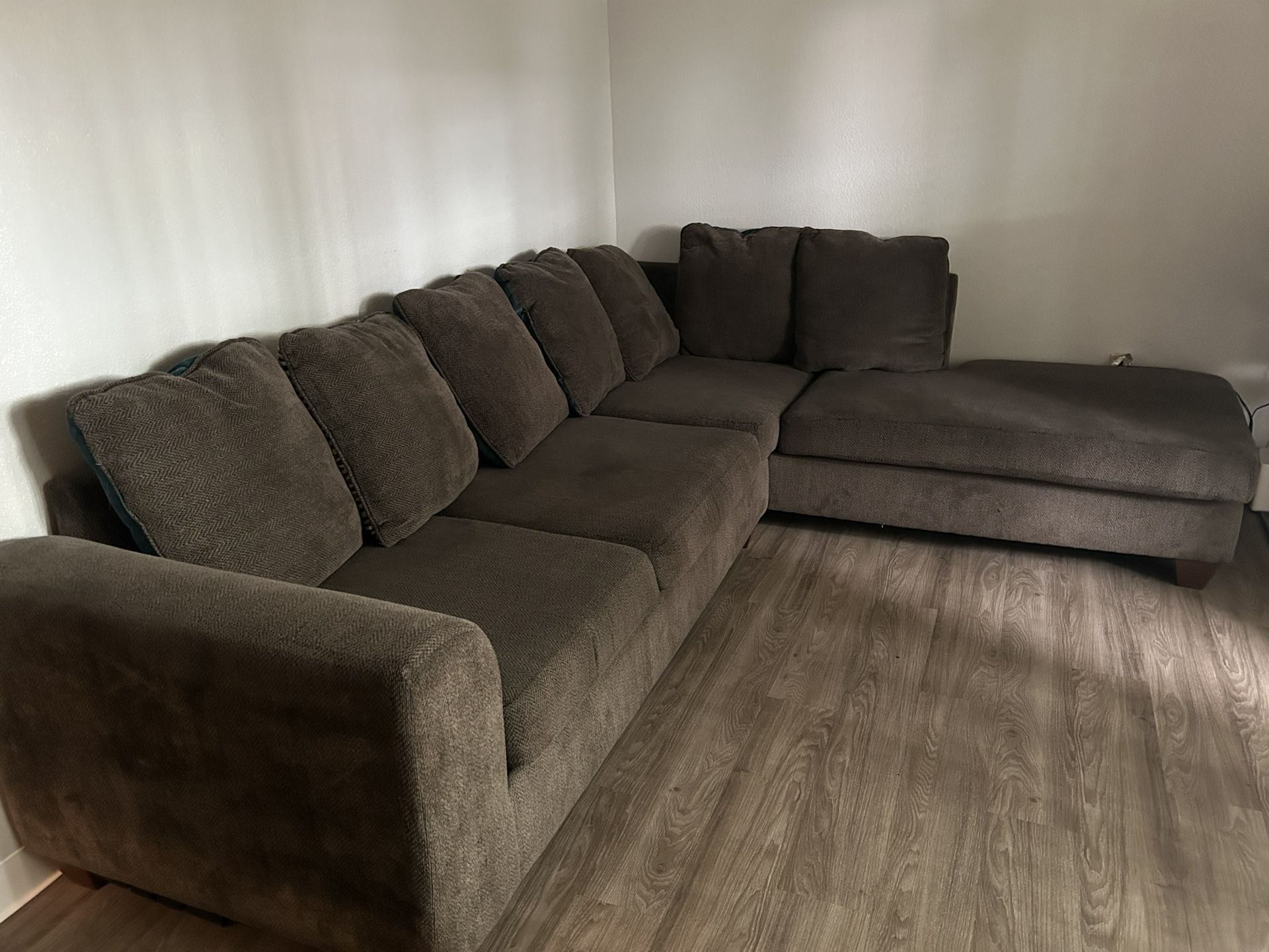 Brown L shaped couch