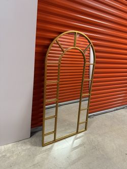 Stylish floor length mirror. Gold window-style frame. Great standing mirror. Height 60 inches. Width 34 inches.