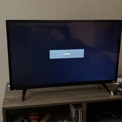 Vizio flat-screen TV in decent condition.