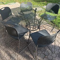 Glass exterior table with 6 chairs
