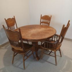 Wooden Table with Four Chairs.