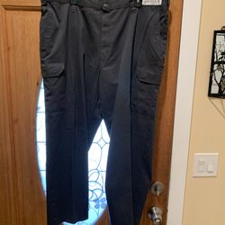 Work pants with an extra pocket on the leg. Color gray. Size: 42. Very good condition. 