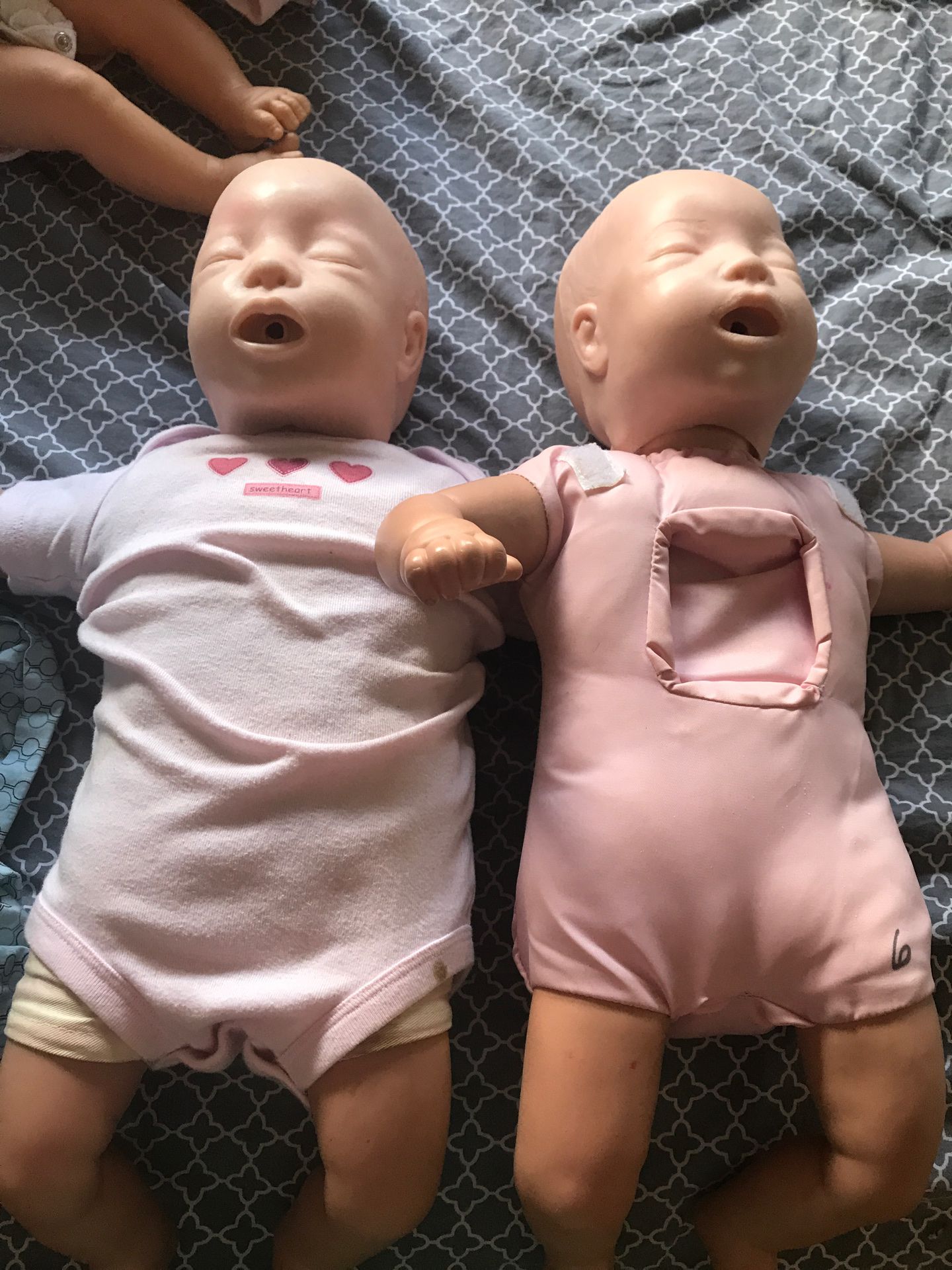 CPR baby dolls and two weights scale