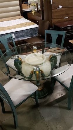 Floor model table & 4 chairs as is