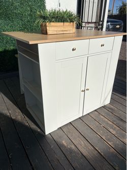 Island bar table with cabinets and drawers