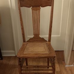 Ohlly crafted antique press back chair with cane seat.