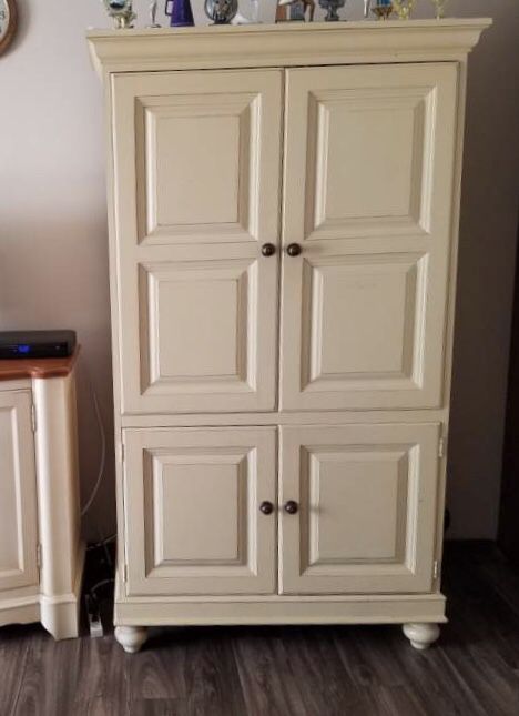 Antique tall storage cabinet