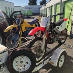 2 Stroke Dirt Bikes On 3 Bike Trailer 