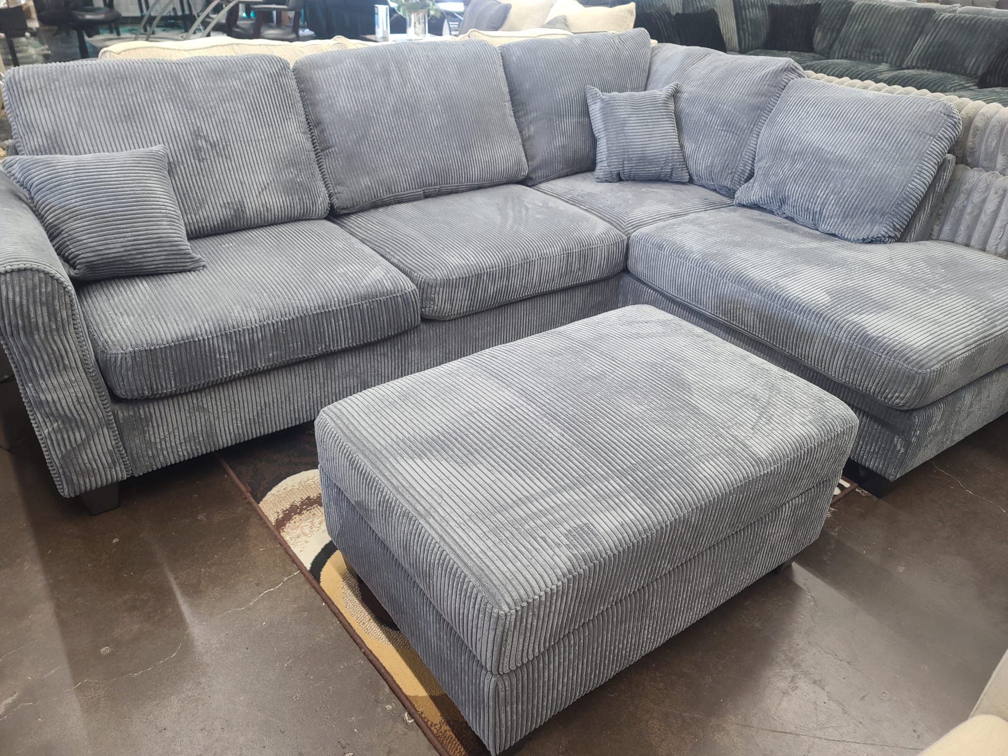 Gray Corduroy Sectional with storage ottoman