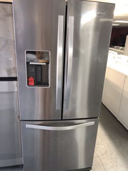 Used whirlpool stainless steel French door fridge. 1 year warranty