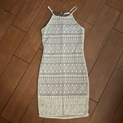 This elegant white sheath dress by Poetry features a sleeveless halter neckline, perfect for wedding guest occasions. The dress is crafted from a text