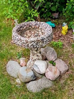 Two piece concrete bird bath.