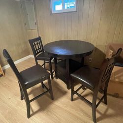 Table with 3 chairs, storage and a leaf