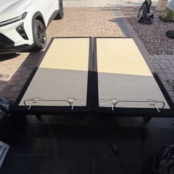 Clean Sealy Ease adjustable bed bases. Has two separate bases, good for a split king mattress. Each base has its own remote control, allowing independ