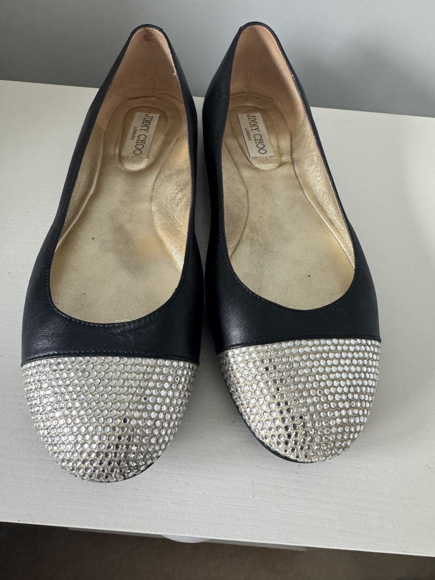 Jimmy Choo black leather ballet flats with a crystal-embellished toe