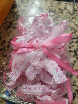 12 Pieces ribbons with "It's a Girl" text, Placex on baby shower favors.