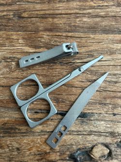 Vintage 3-piece manicure/grooming set including nail clippers, scissors, and nail file/buffer.