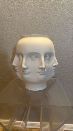 This white ceramic vase is a TMS Perpetual Faces piece from 2005, designed in a surrealist Fornasetti style