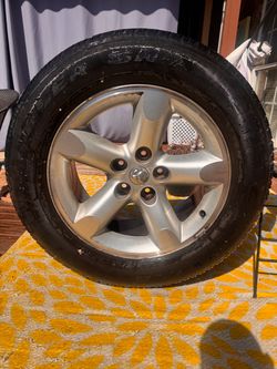 20” Dodge/Ram-style OEM wheel with the P275/60R20 tire