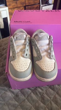 Toddler Nike Dunk Low sneakers in a white and gray colorway