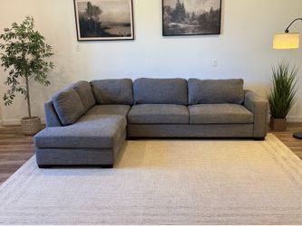 Gray Costco sectional couch delivery available