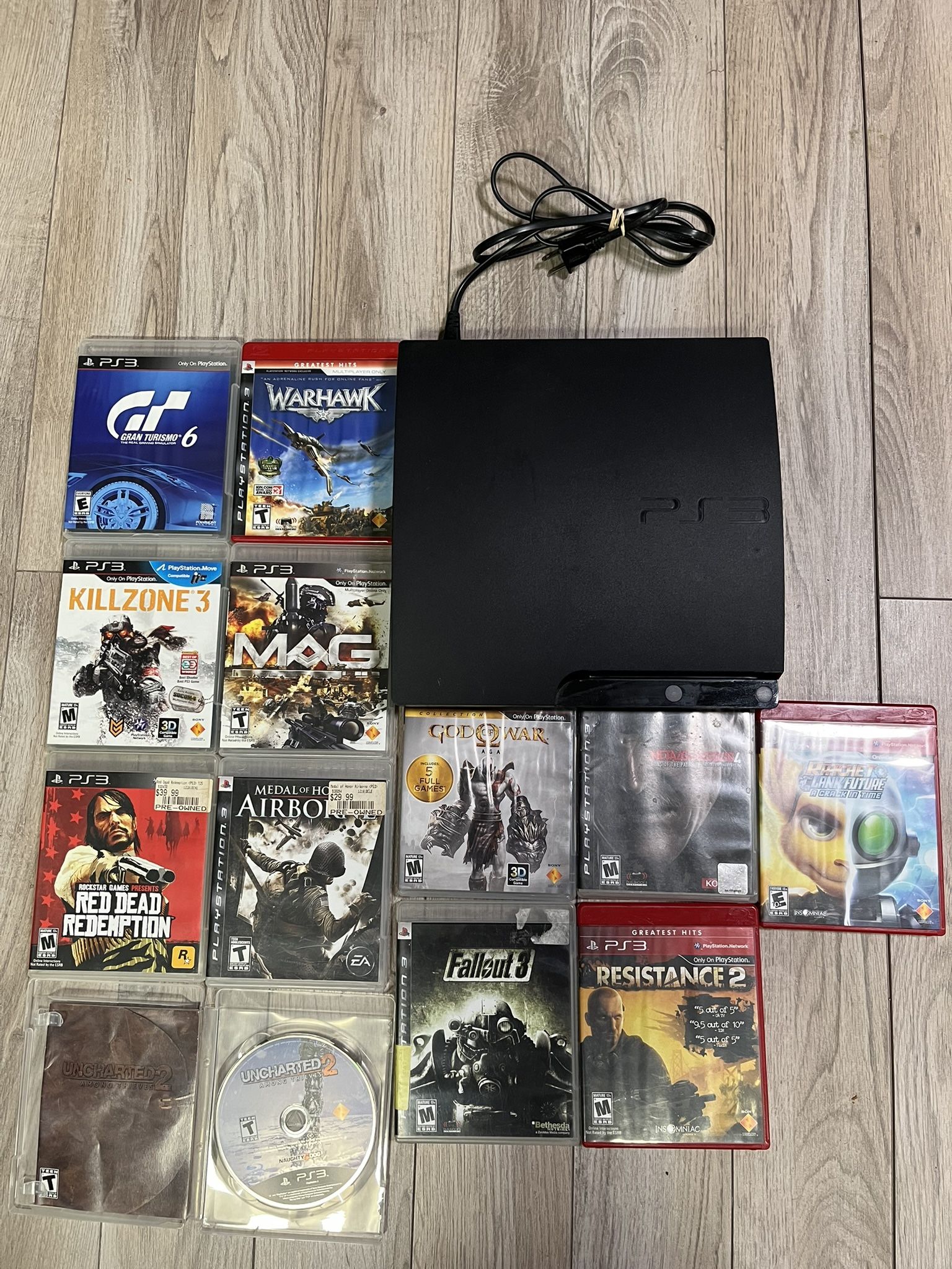 PlayStation 3 Slim – 12 Games ( No controller ) 