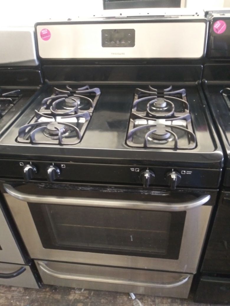 Frigidaire black and stainless steel 4-burner gas