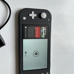 Nintendo Switch Lite With Charger And Game 
