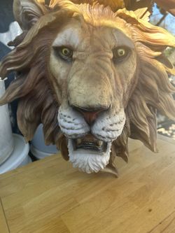 Lion And Wolf Head Statues