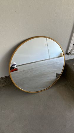 Gold frame circle mirror