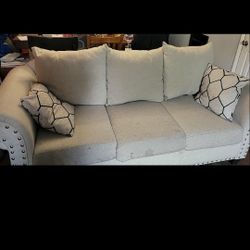 Free Beige Sofa with Cushions and Coffee Table