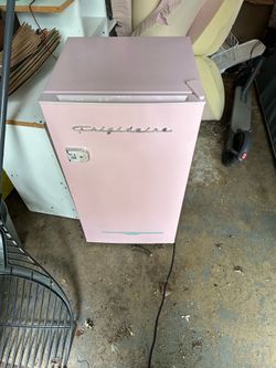 Pink Frigidaire mini fridge and freezer