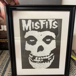 image features the iconic "Fiend Skull" logo of the American horror punk band, the Misfits. This specific piece appears to be a stylized, possibly han