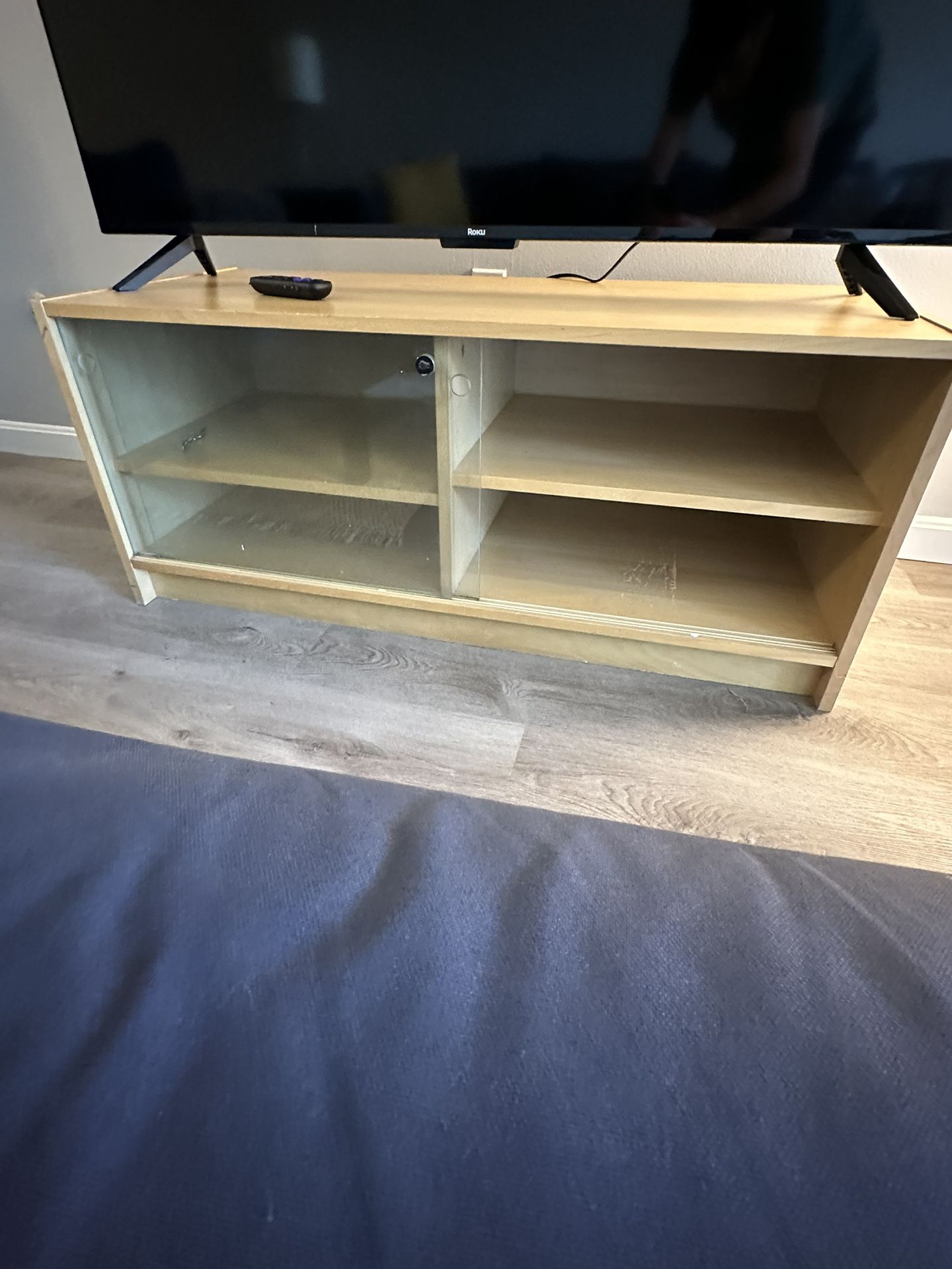 TV stand with storage space, shelving, sliding doors